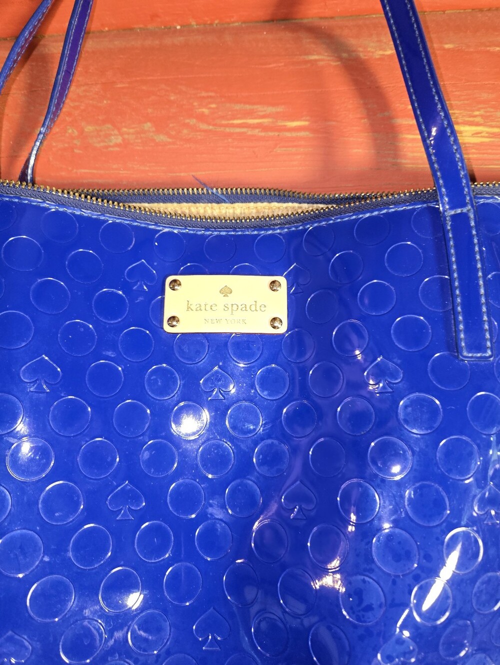Damage On Handle     kate spade cobalt patent tote with embossed dots and spades